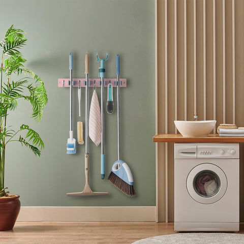 OUTNILI pink mop holder in laundry room setup keeps brooms organized and off the floor