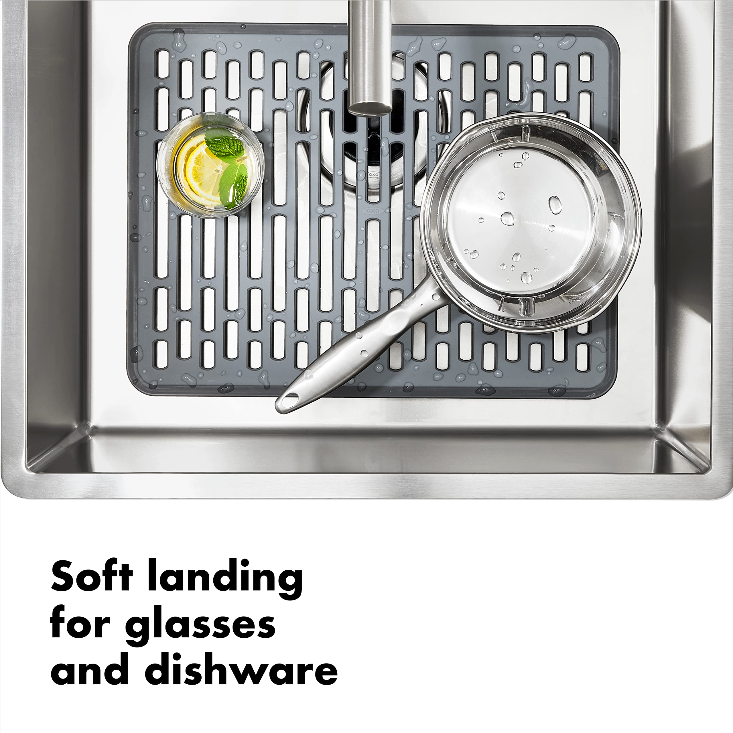 OXO Good Grips silicone sink mat large drain-pattern close-up demonstrates cut-hole design.