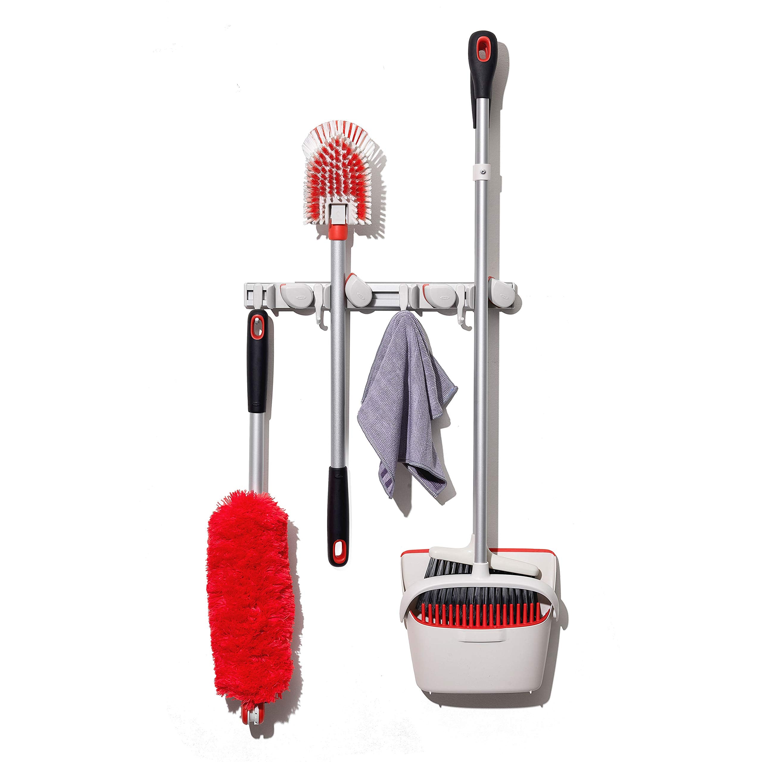 OXO Good Grips wall-mounted organizer stores broom neatly and accessibly