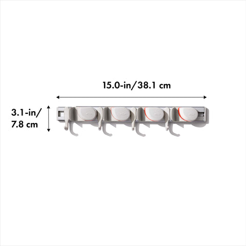 OXO Good Grips wall-mounted organizer secures duster with non-slip grip