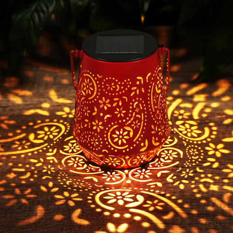 OxyLED solar lanterns create cozy dusk ambiance with color from hanging lanterns.
