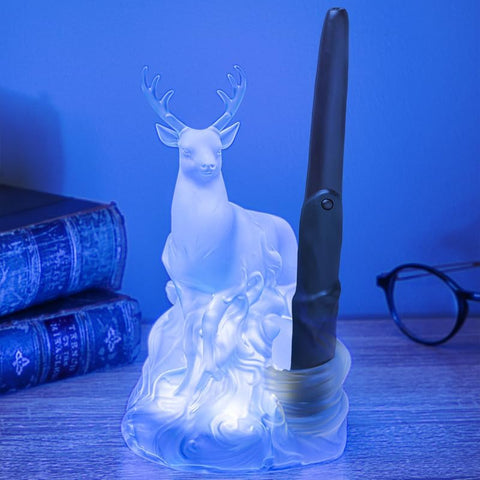 Wand remote control activates light, simulating spellcasting on a nightstand