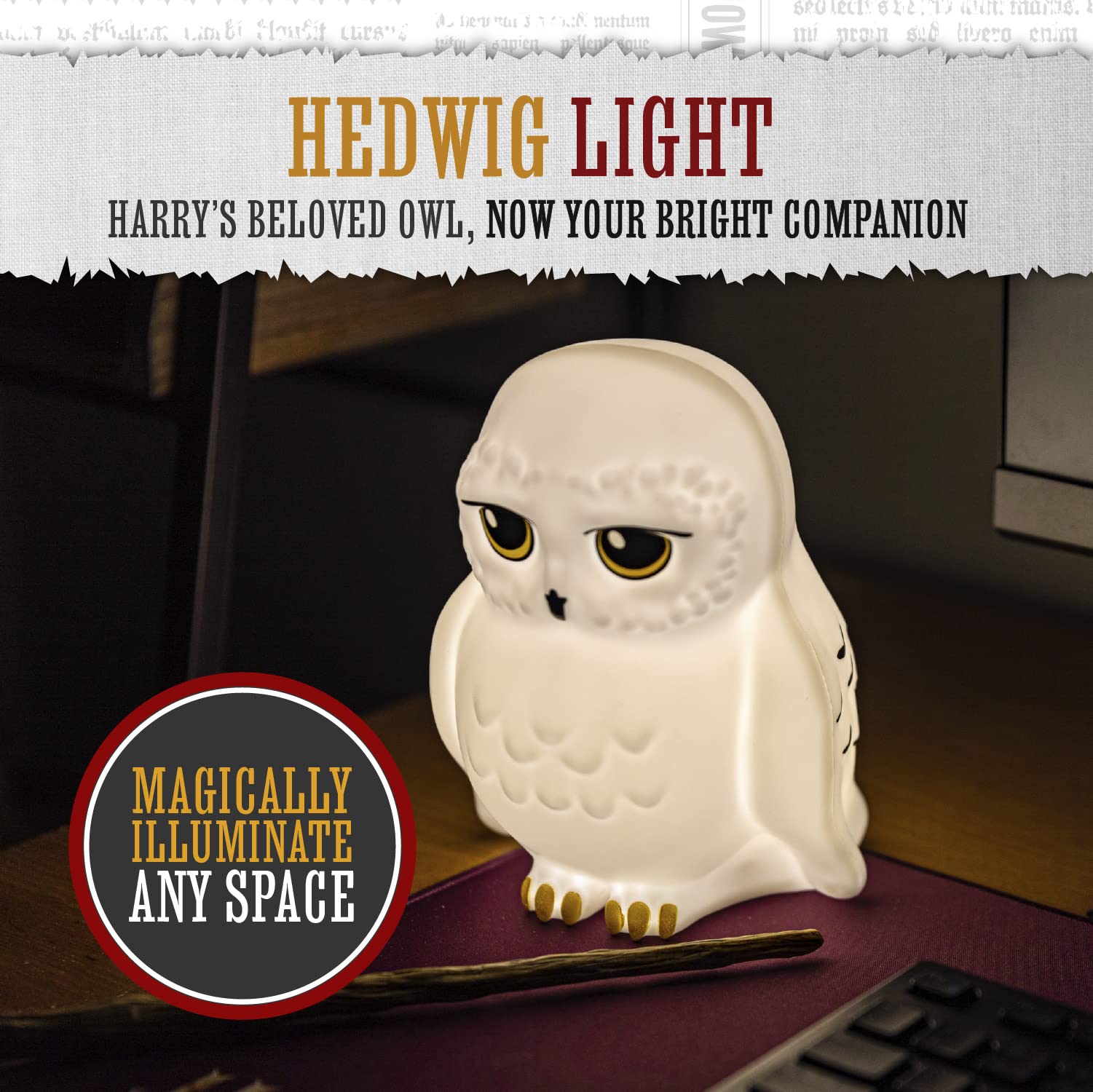 Paladone Hedwig owl light adds cozy glow to bedroom decor.