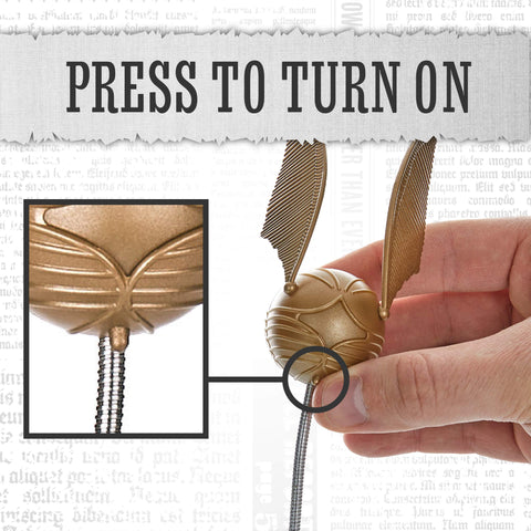 Paladone Snitch hovering over a page provides focused lighting for comfortable reading