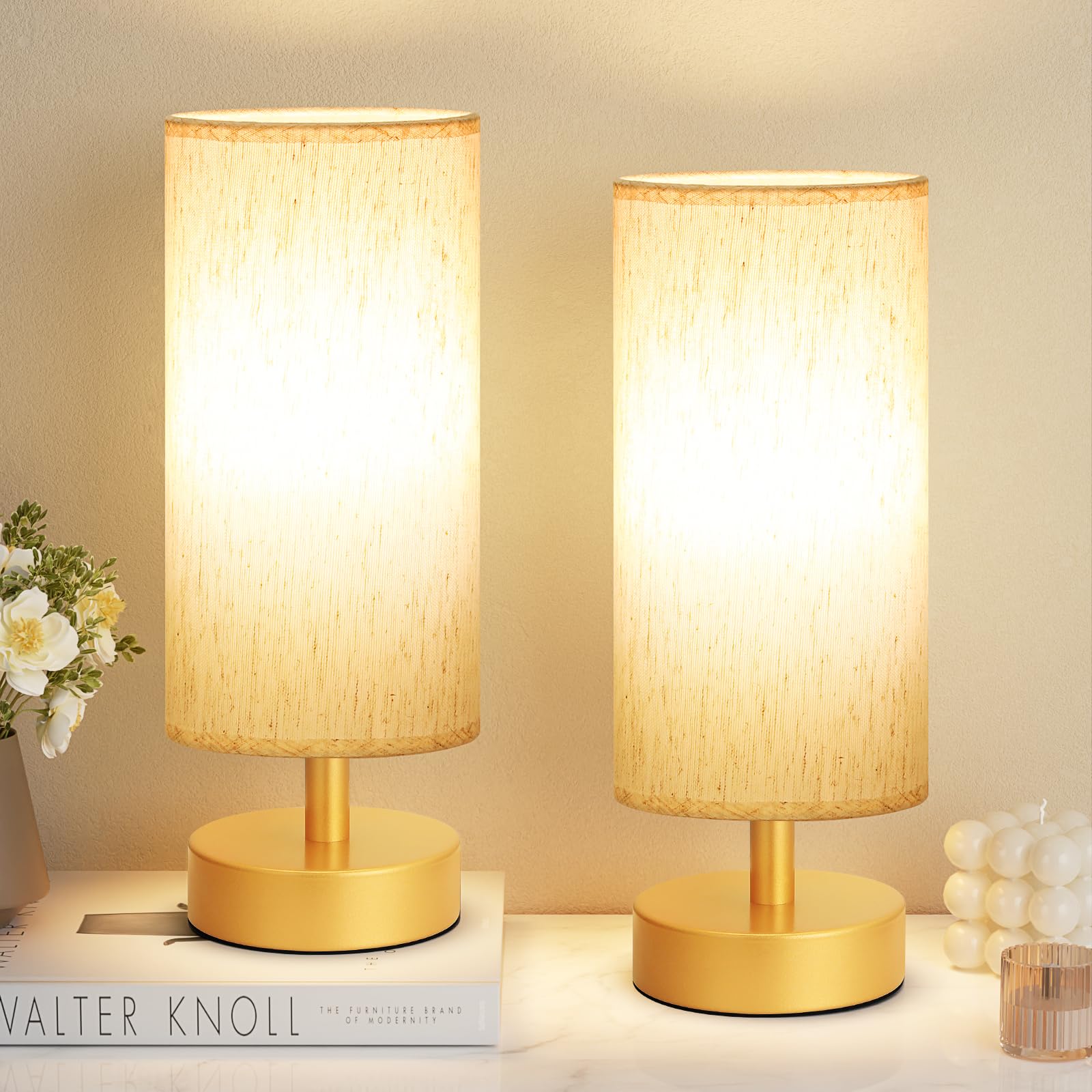 PartageiZ small table lamp in gold on a nightstand with warm ambient light