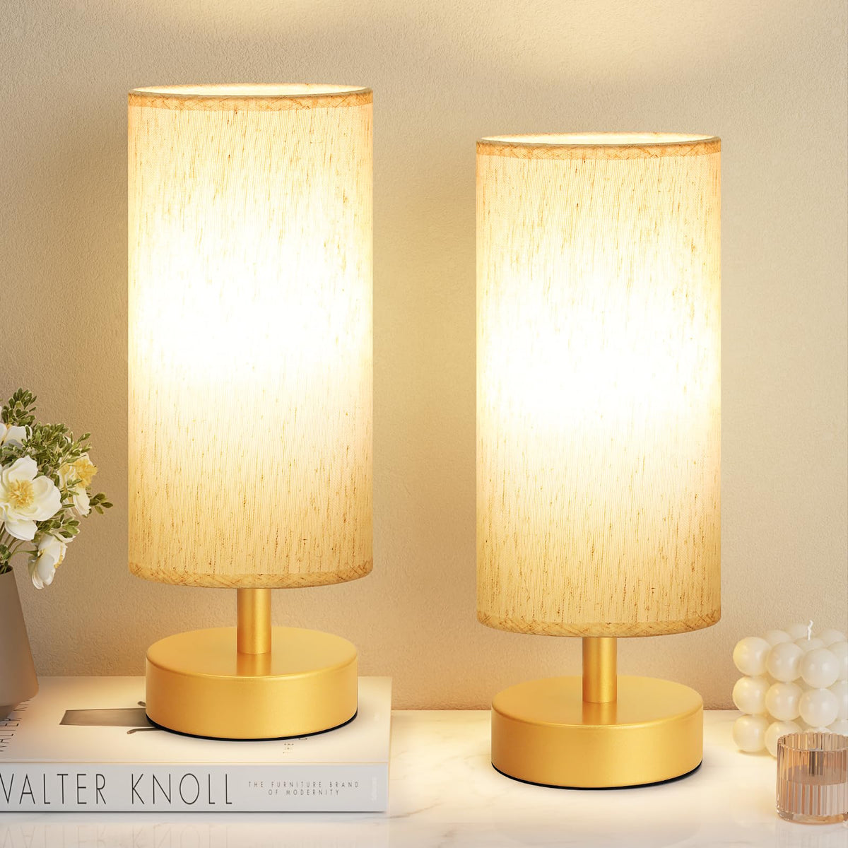 PartageiZ small table lamp in gold on a nightstand with warm ambient light