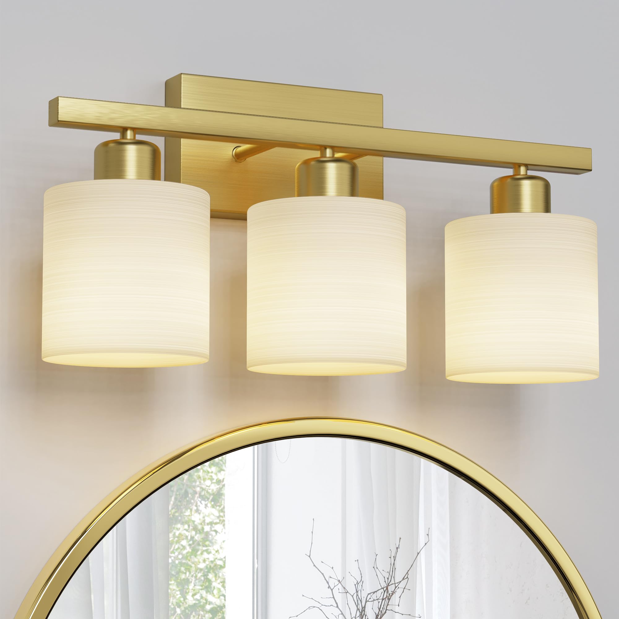 PARTPHONER 3-light brushed-gold vanity light with textured white shade enhances bath ambiance.