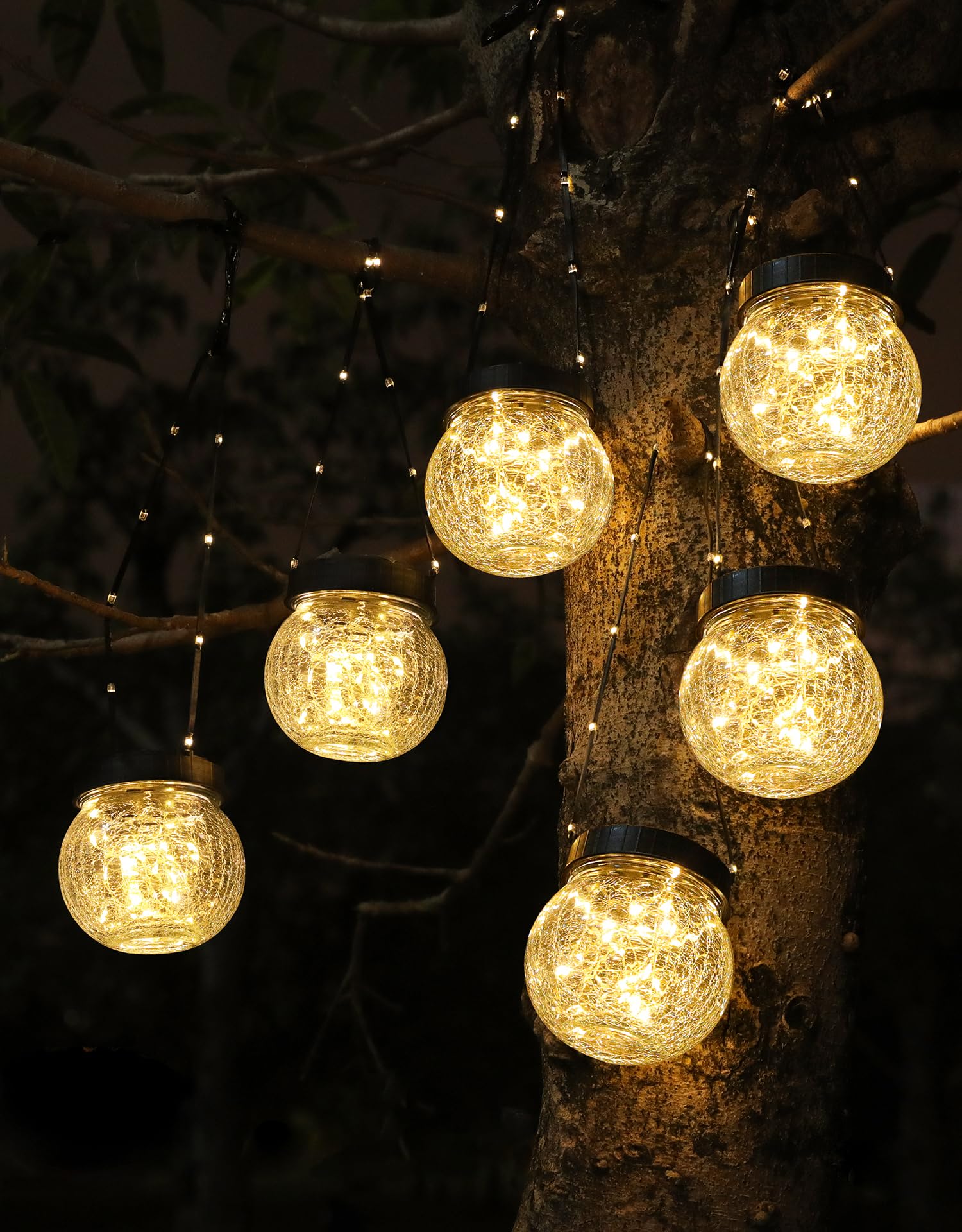 PARTPHONER solar lantern cracked-glass hanging globe glows warmly for outdoor evenings in gardens.