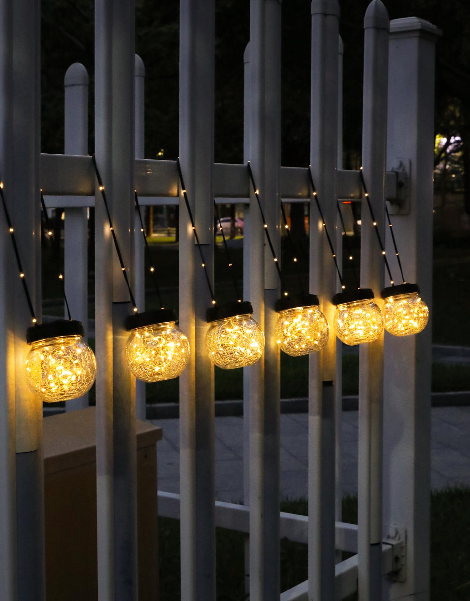 Partphoner hanging solar lantern on shepherd hook ready for outdoor ambiance