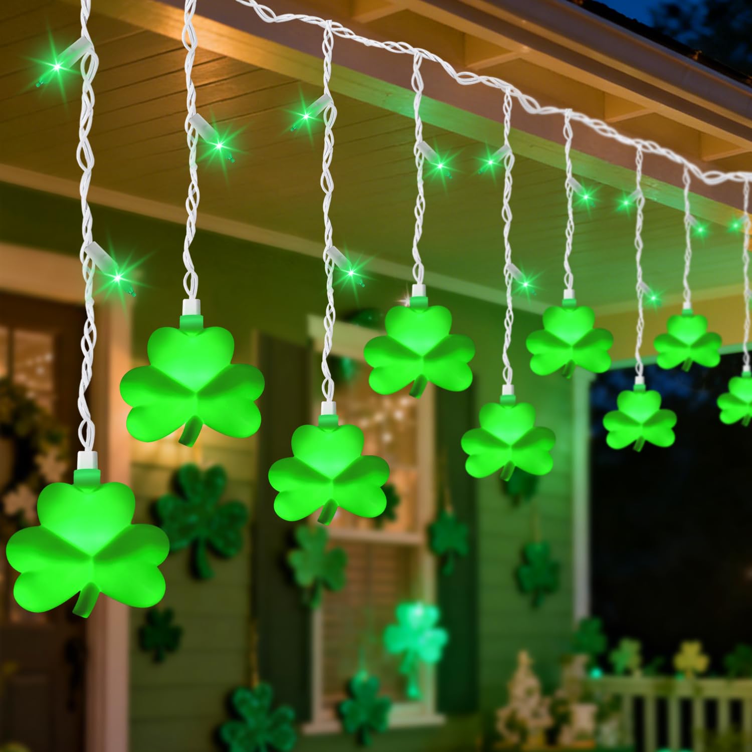 PASUTO green shamrock icicle lights illuminate windows with a festive indoor glow