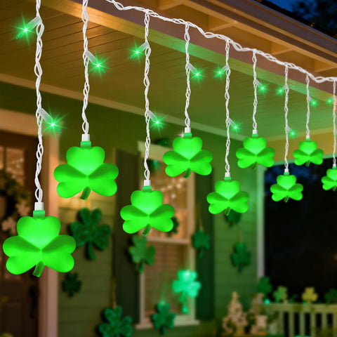PASUTO green shamrock icicle lights illuminate windows with a festive indoor glow