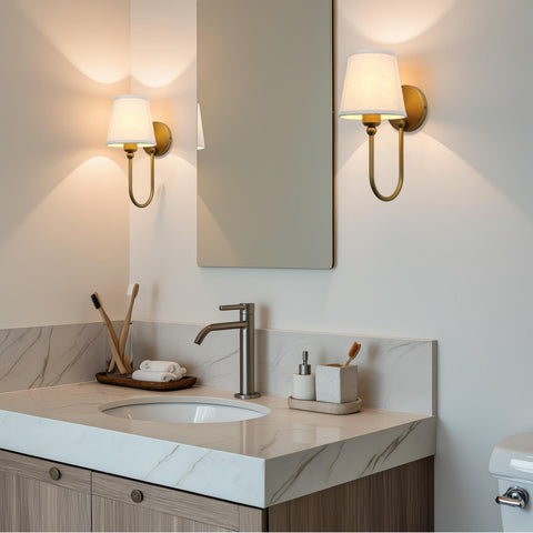 Pathson antique linen sconce curved-arm side view framing rooms with soft ambient glow.