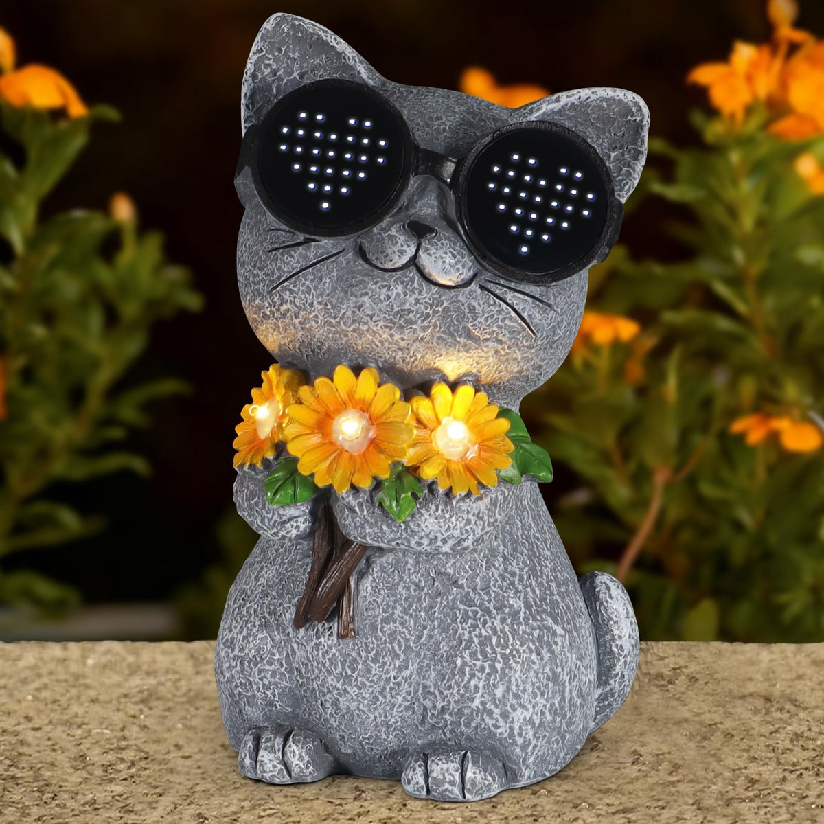 Pawatee cat daisy solar statue shines at dusk with eco-friendly garden illumination.
