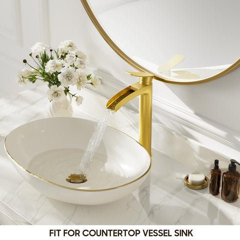 Phiestina brushed gold tall faucet spout closeup highlighting the waterfall flow.