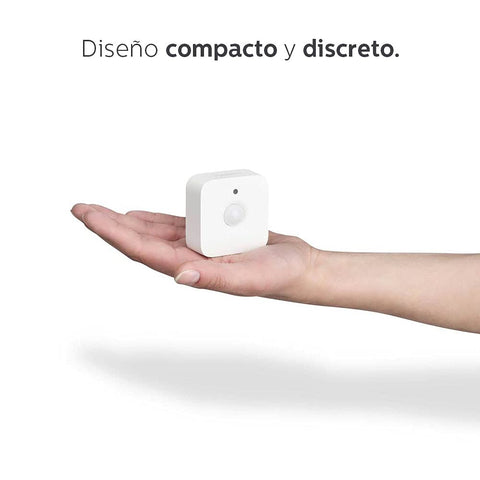 Philips Hue motion sensor automatically turns lights on when entering a room.