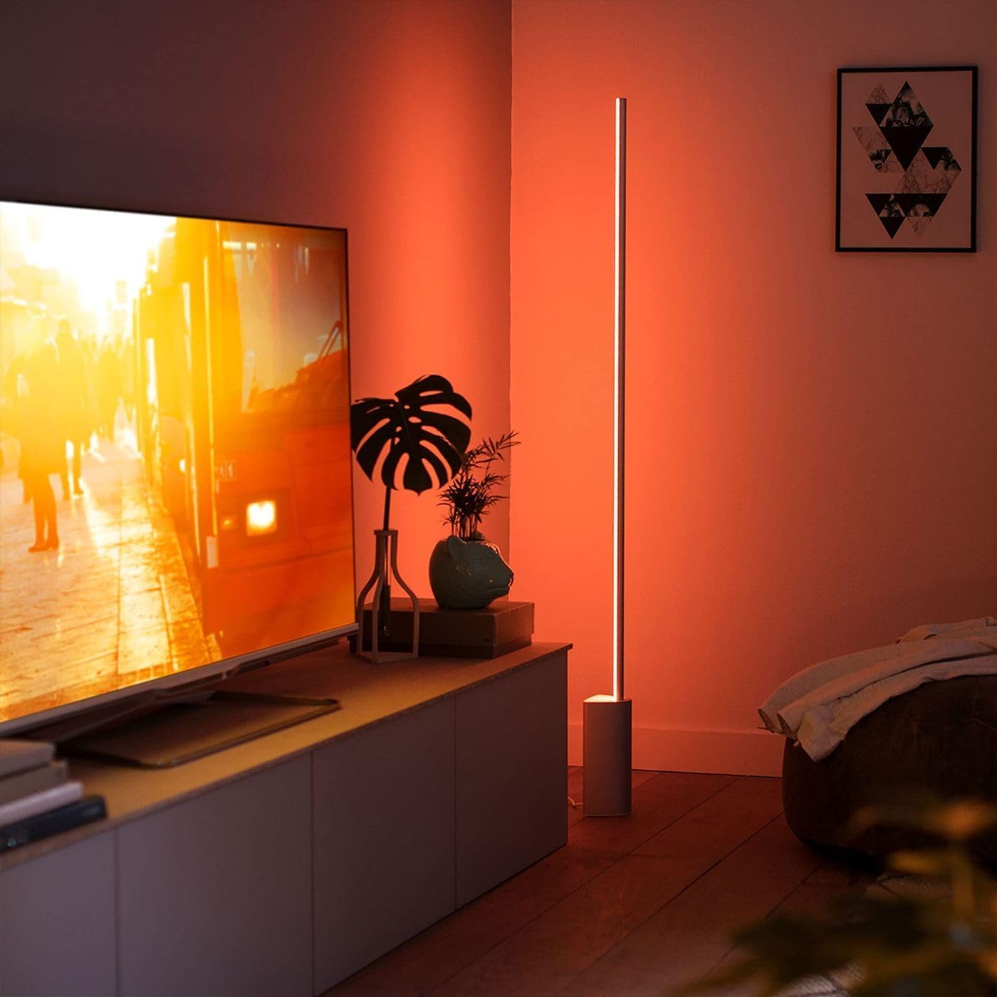 Bedroom ambiance with Philips Hue Signe adds warm white and color accents.