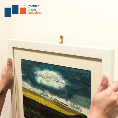 Picture Hang Solutions 100-pack hooks and nails ensure secure displays.