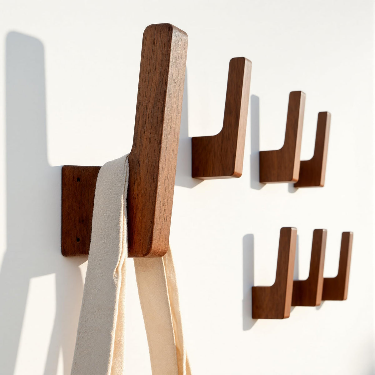 PinEther 6-pack walnut wall hooks with hidden mount for a clean, floating look.