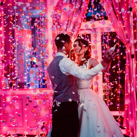 PIONJOY wedding party lights adding soft pink-red glow to decor