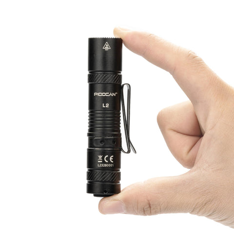 PIOOCAN rechargeable flashlight with clip for quick access on gear.