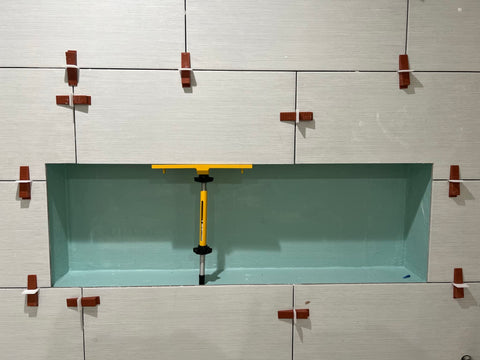 Planum holding plate highlights adjustable fit for varied niche depths.