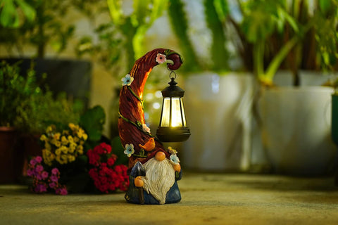 Pohabery Gnome Lantern Night Light casting warm light on pathway.