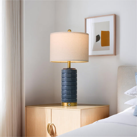 Pair of PoKat lamps providing balanced bedside illumination in a room