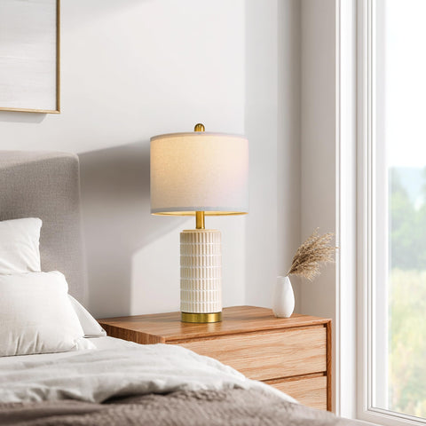 PoKat white-beige ceramic lamp on end table complements living room decor