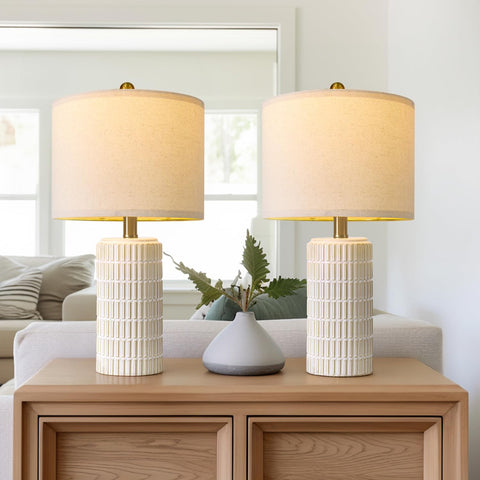 Warm glow from PoKat lamps creates inviting ambience on bedside tables