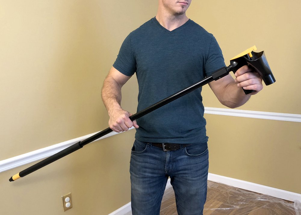 POP EEZE tool with funnel and blades demonstrates minimized mess during ceiling treatment.