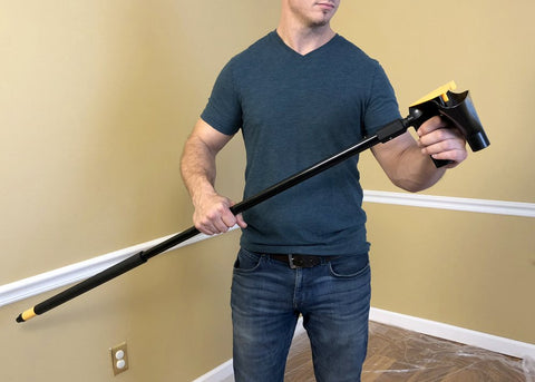 POP EEZE tool with funnel and blades demonstrates minimized mess during ceiling treatment.