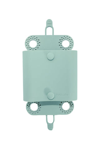 Porcupine shower hair catcher on sage-green wall catching hair to reduce clogs