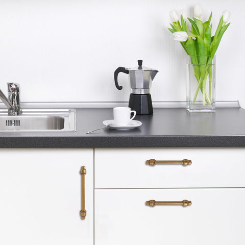 POVEFONK dresser drawer pull in antique brass enhances traditional room style.