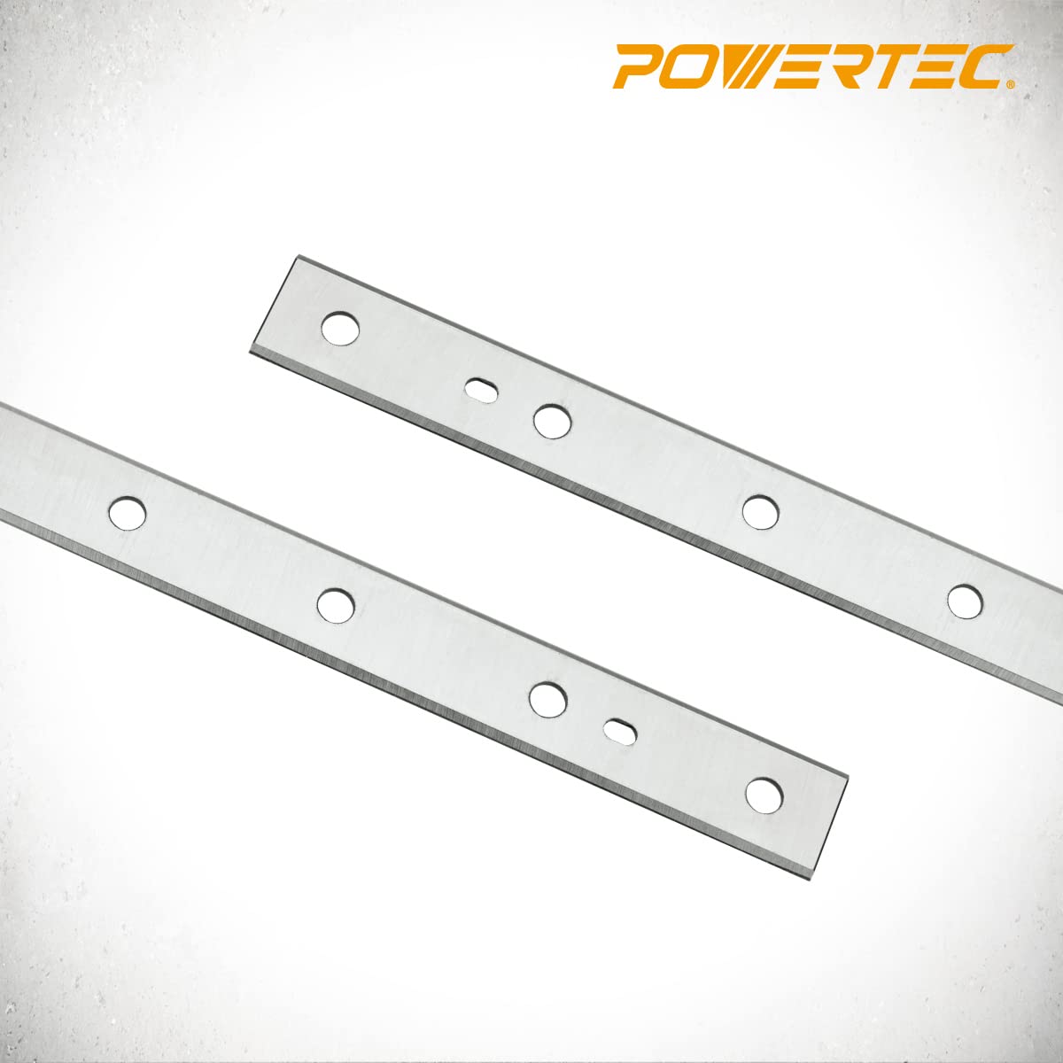 POWERTEC HSS planer blades show machined locator holes for precise setup