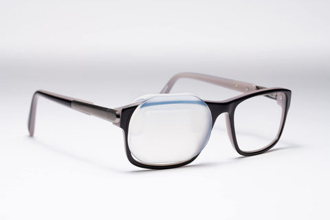 Precision Vision OPTISHIELD silicone occluder attached to glasses enables hands-free eye occlusion.