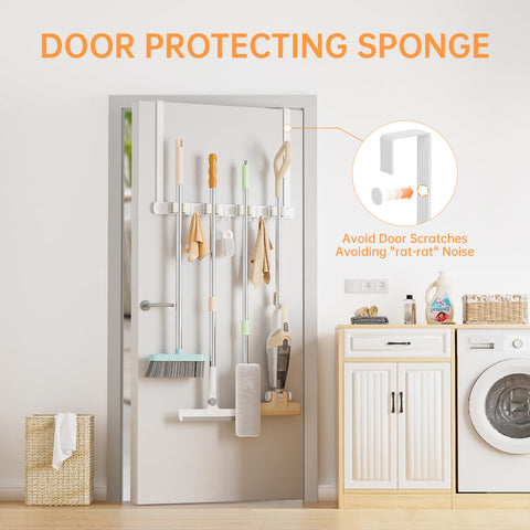 PrimZooty wall-mounted broom holder makes tool insertion easy with rubber rollers.