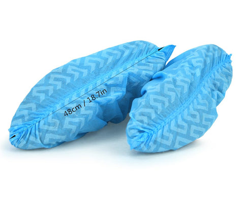QIAN SOU elastic-opening boot covers demonstrate secure fit during tasks.