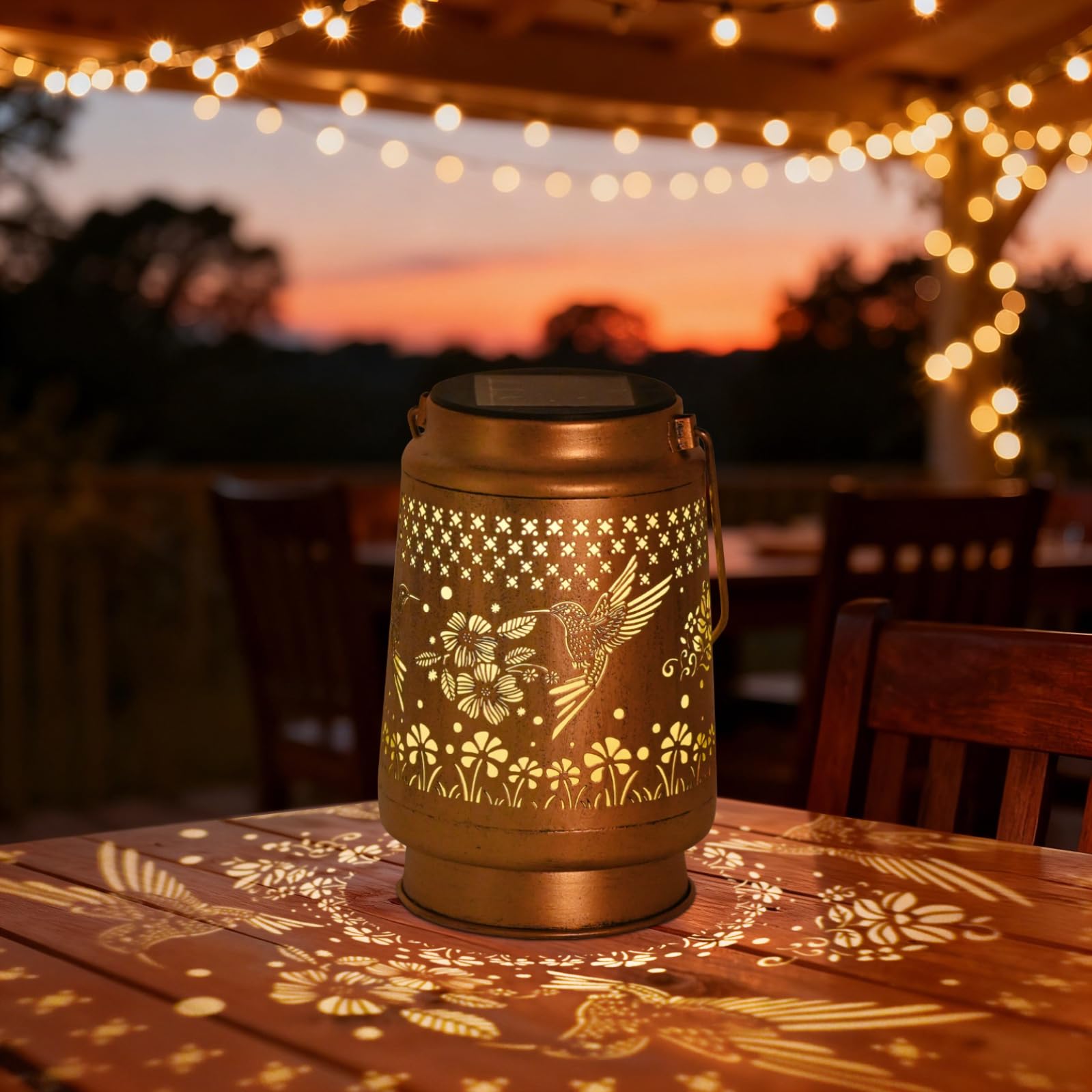 QPPDER hummingbird solar lantern hanging from a tree for cozy uplight