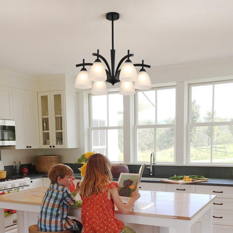 Q&S six-light kitchen chandelier adds modern warmth to dining and prep area.