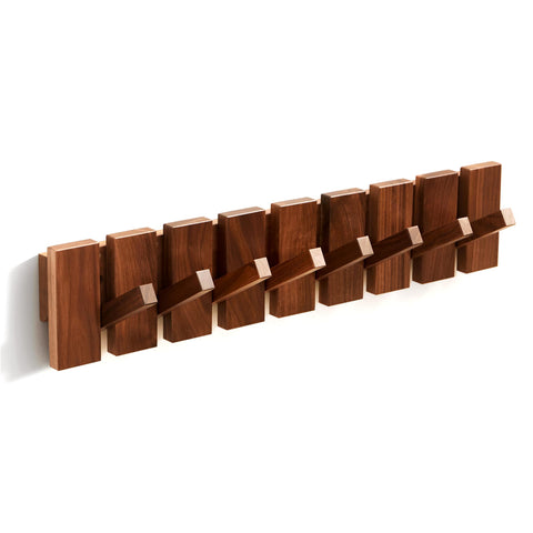 Quellance decorative wall rack blends art and function in living spaces.