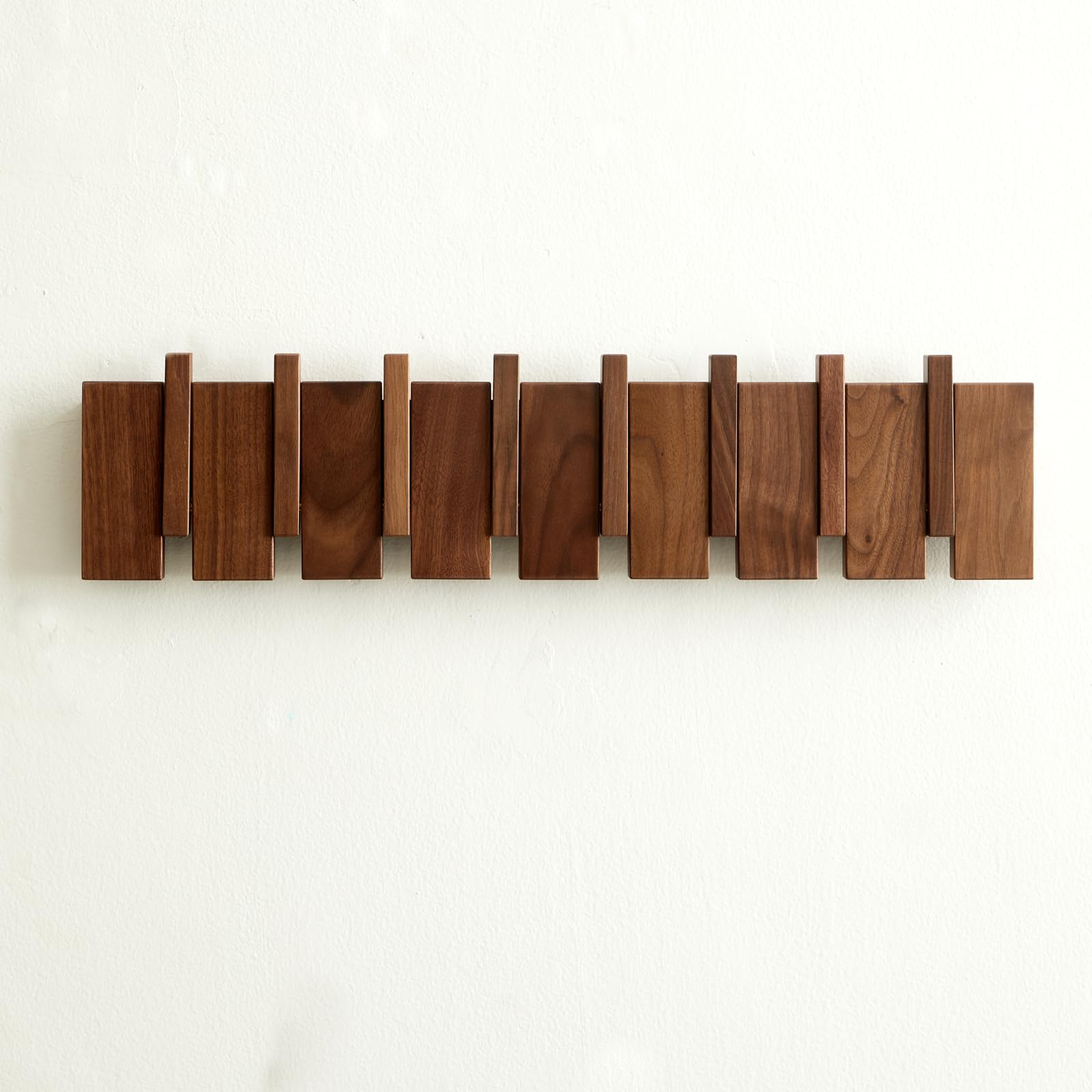 Quellance wood coat rack wall mount with piano-key design saves space in entryways.