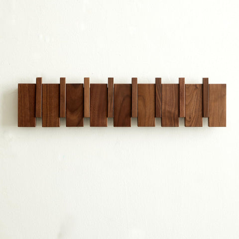 Quellance wood coat rack wall mount with piano-key design saves space in entryways.