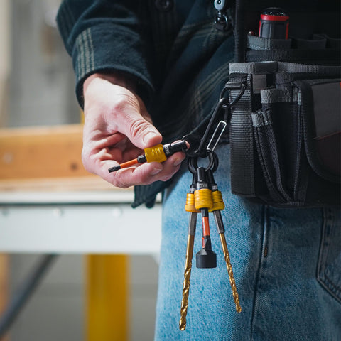 Railer Bit Holder keychain in use with a drill for fast changes.