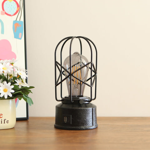 Rarlonly bedside lamp on a nightstand beside books and cup