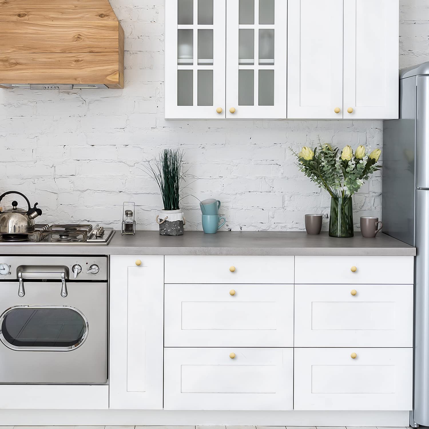 Ravinte brushed brass hardware complements warm tones in modern interiors.