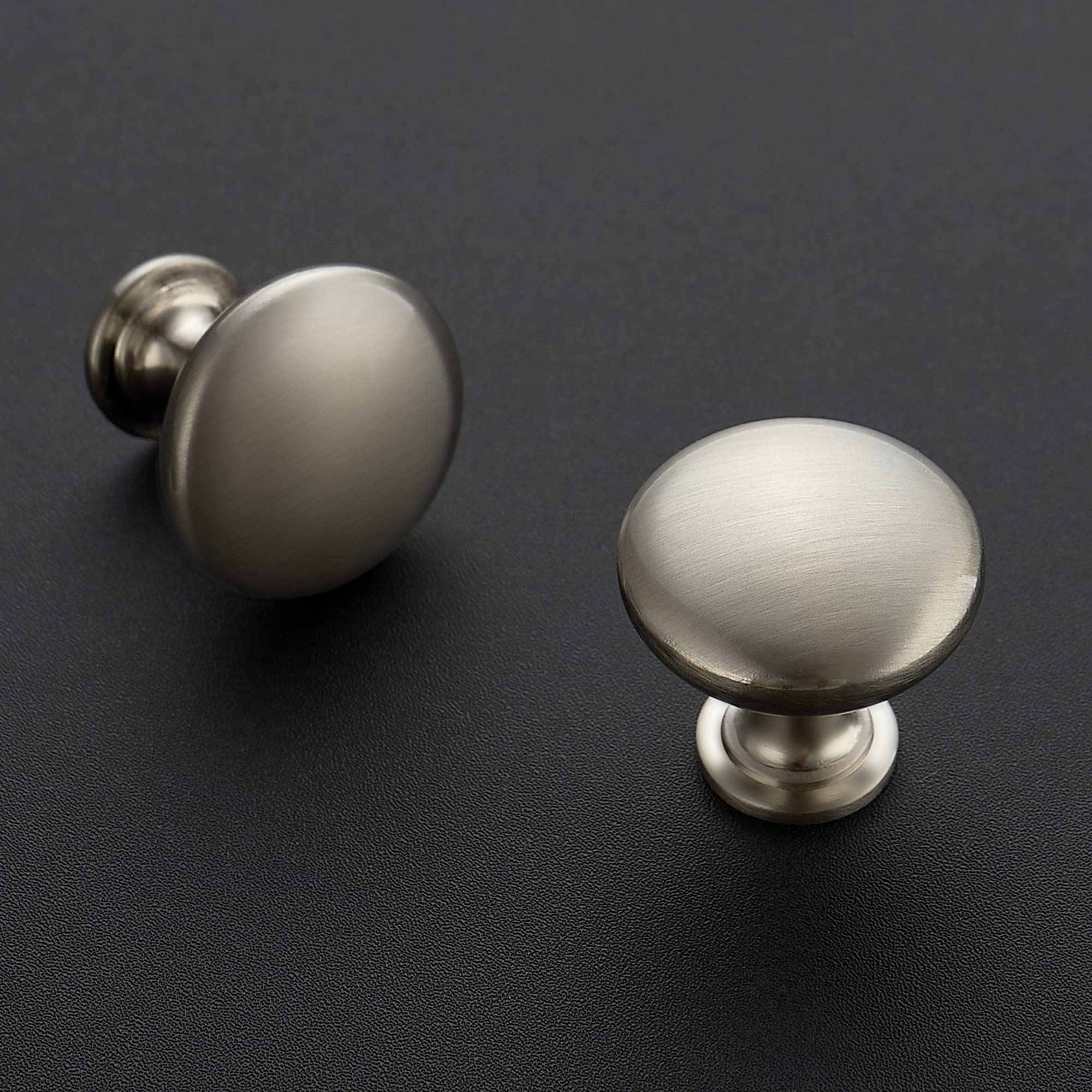 Ravinte brushed nickel round cabinet knob on a bathroom vanity, versatile finish