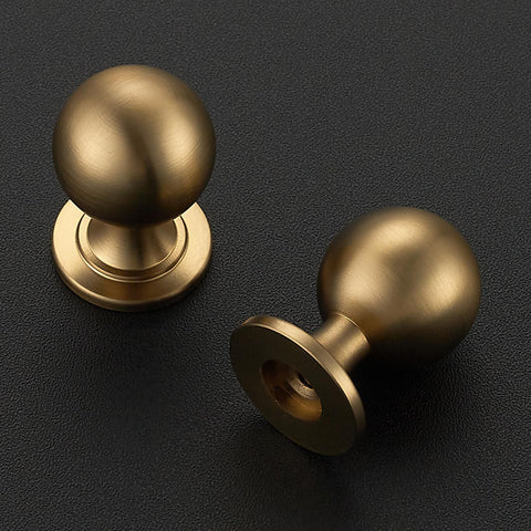 Ravinte Decor champagne bronze round knob angled view highlights comfortable grip and stylish hardware.