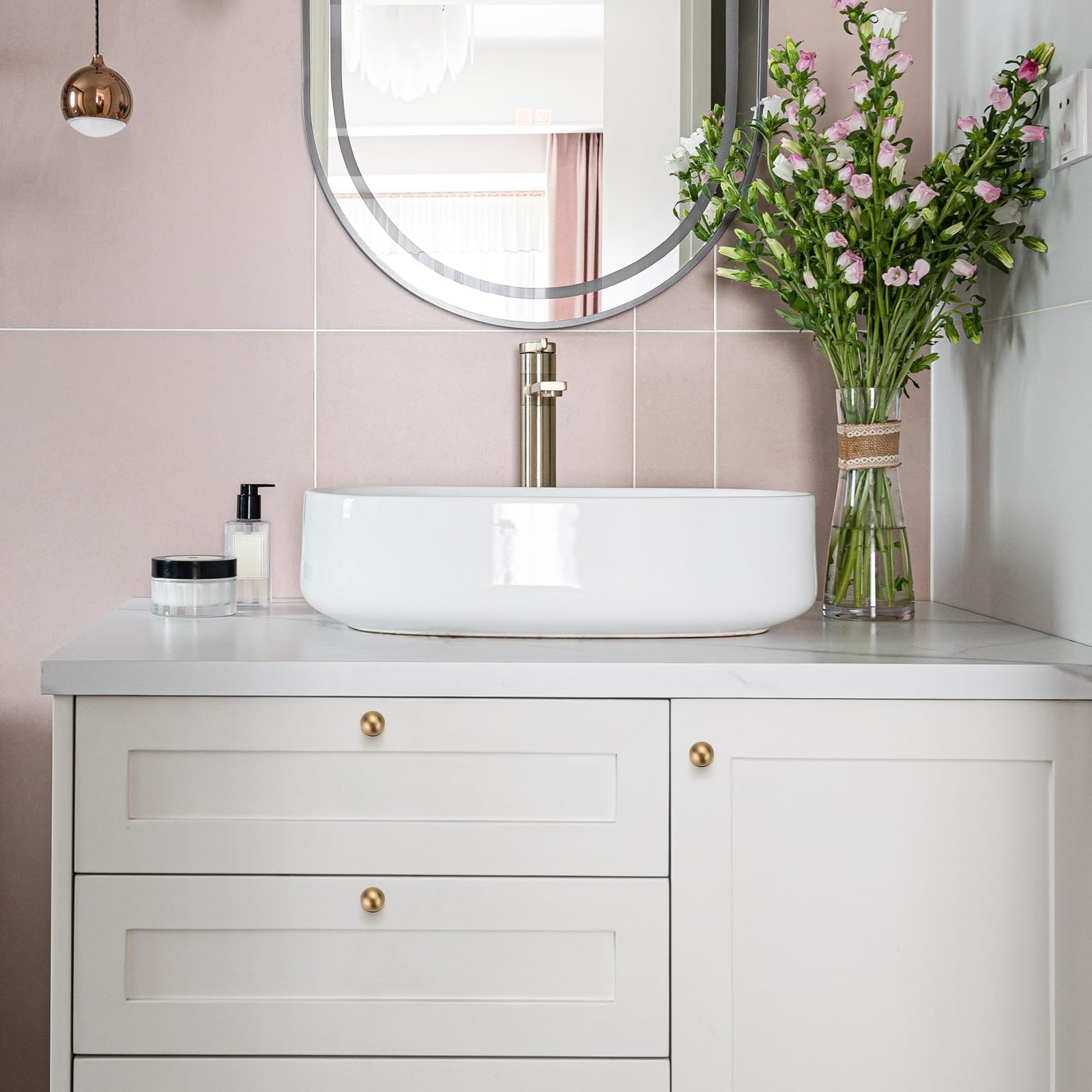 Ravinte Decor champagne bronze round knob on a drawer highlights warm finish and comfortable grip.