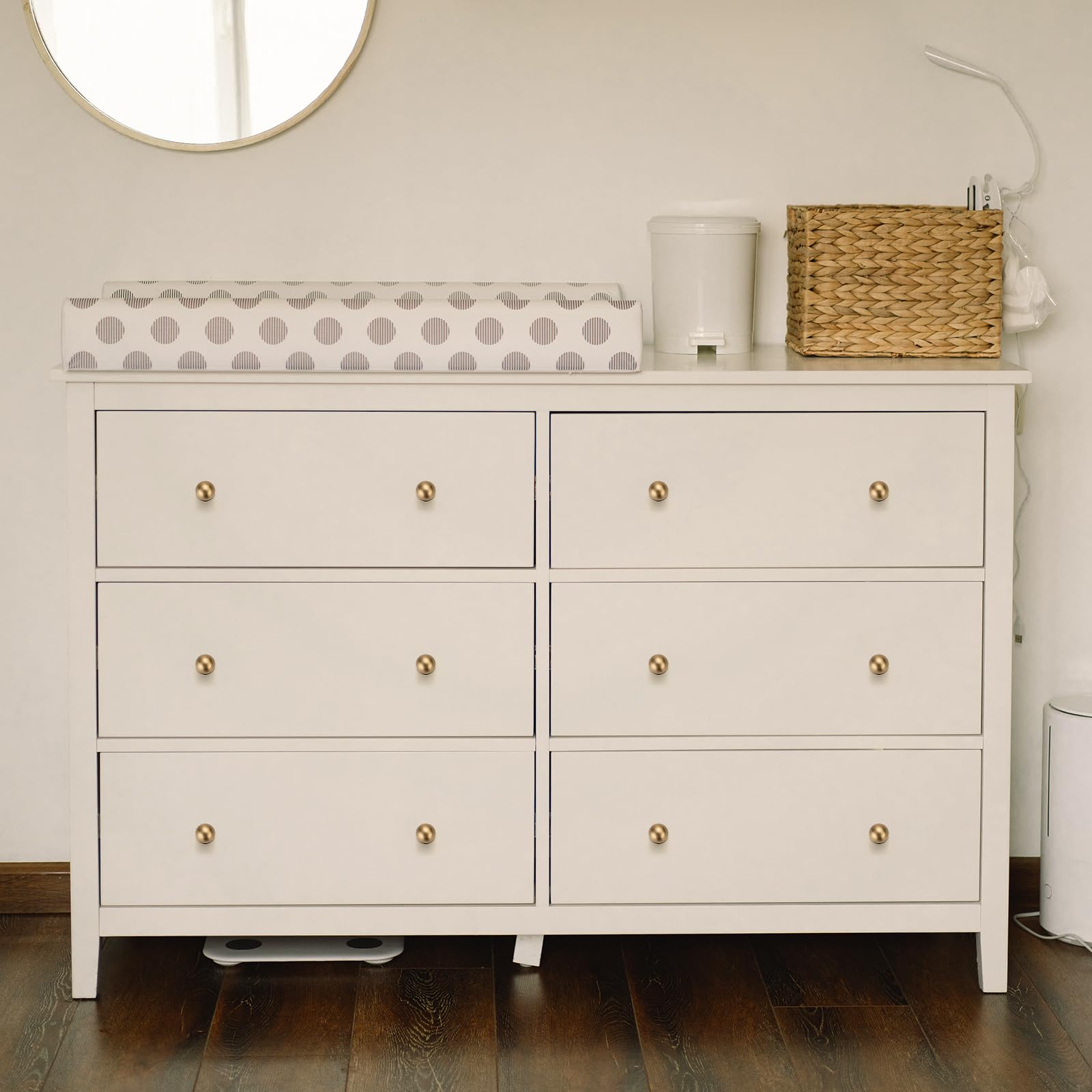 Ravinte Decor champagne bronze round knob on a dresser complements various styles with durable finish.