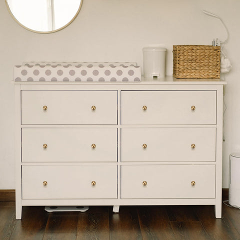 Ravinte Decor champagne bronze round knob on a dresser complements various styles with durable finish.